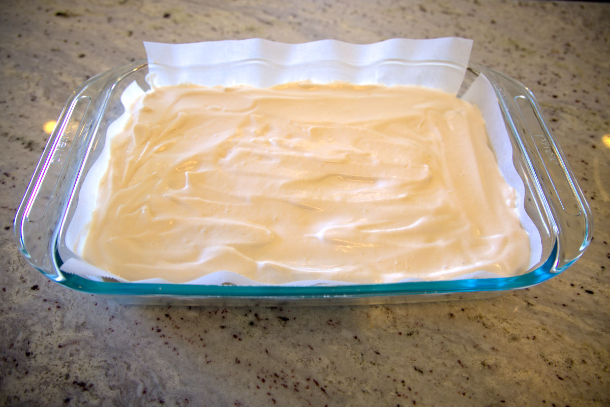 marshmallow spread in a lined baking dish