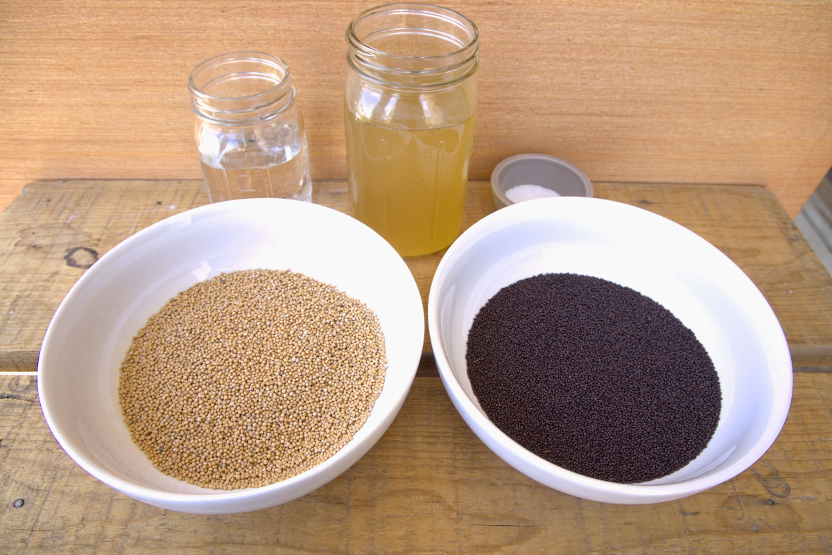 yellow and brown mustard seeds alongside rest of ingredients for homemade whole grain mustard