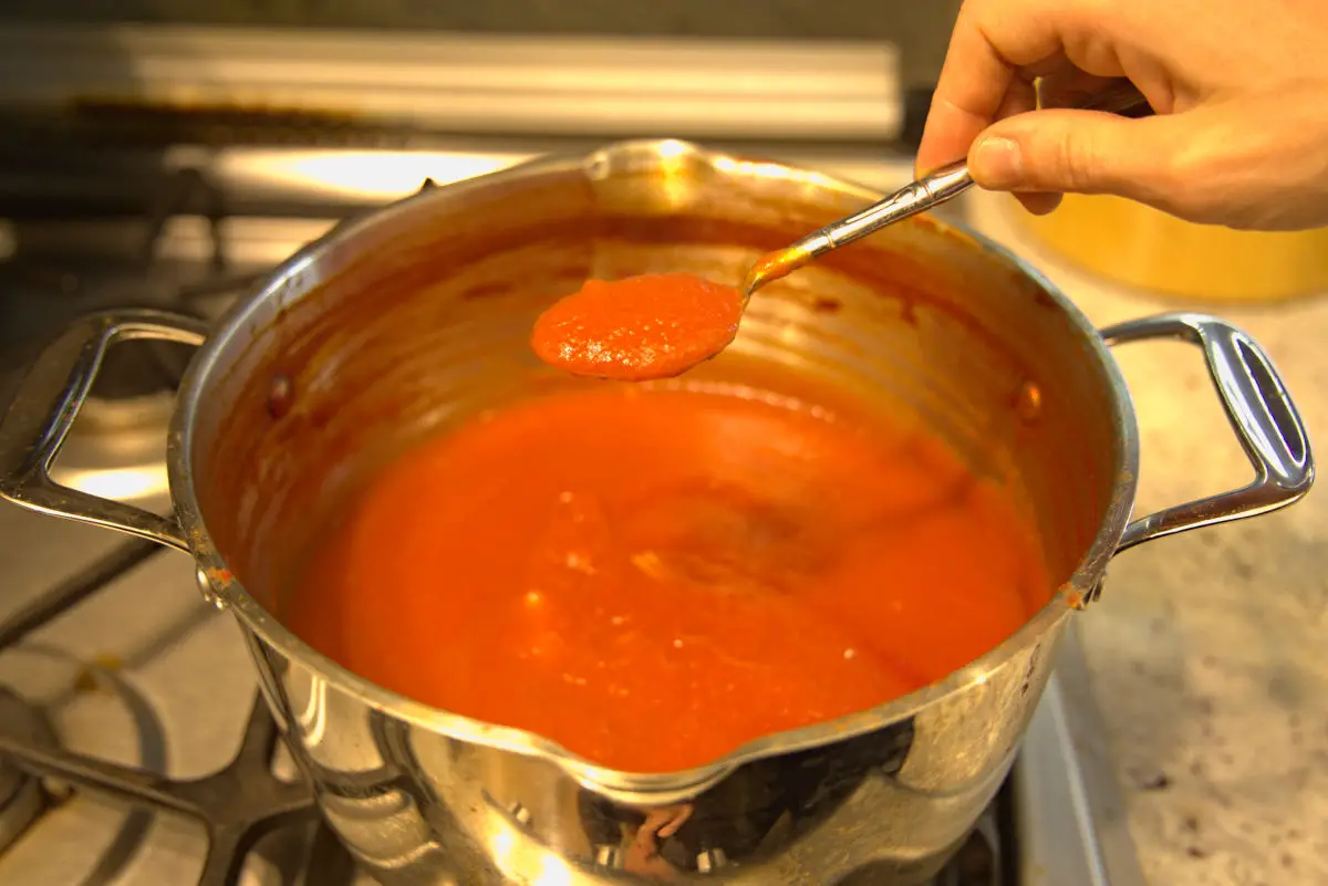 homemade tomato paste thickening on stovetop