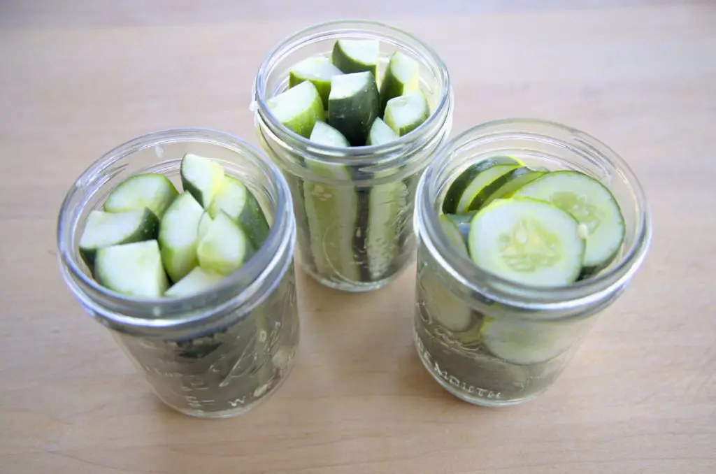 cucumbers packed in jars for homemade pickles